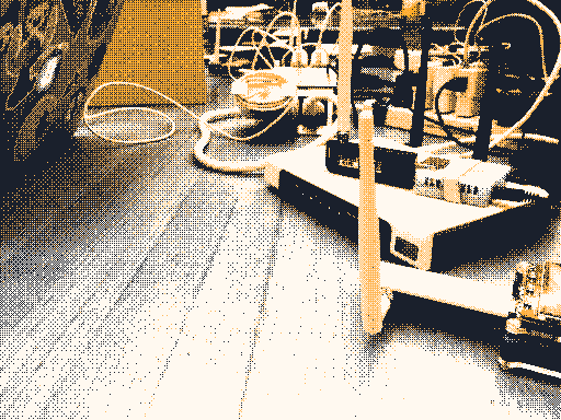 Dithered photograph of some wireless hardware on a table