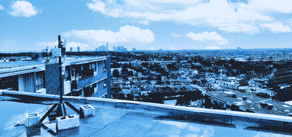 Dithered photograph of a rooftop antenna