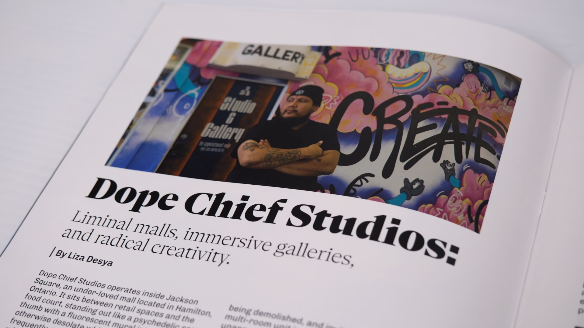 Closeup of a magazine article with the title 'Dope Chief Studios: Liminal malls, immersive galleries, and radical creativity'